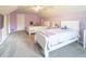 Charming bedroom with two twin beds and a ceiling fan at 1080 Buena Vista Ave, Brooksville, FL 34601