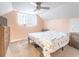 Primary bedroom with a queen bed and ceiling fan at 1080 Buena Vista Ave, Brooksville, FL 34601