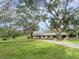 House exterior showcasing landscaping and driveway at 1080 Buena Vista Ave, Brooksville, FL 34601