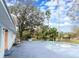 Backyard view of the house and kidney shaped pool at 1080 Buena Vista Ave, Brooksville, FL 34601