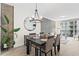 Bright dining room with chandelier and seating for four at 1120 E Kennedy Blvd # 413, Tampa, FL 33602