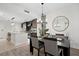 Dining room with chandelier and view into kitchen at 1120 E Kennedy Blvd # 413, Tampa, FL 33602