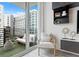 Living area with balcony access and stylish decor at 1120 E Kennedy Blvd # 413, Tampa, FL 33602