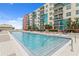 Refreshing community pool with building backdrop at 1120 E Kennedy Blvd # 413, Tampa, FL 33602