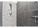 Modern shower with gray tile and a rainfall shower head at 1120 E Kennedy Blvd # 413, Tampa, FL 33602