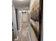 Long hallway with grey walls and wood-look flooring at 11719 Mango Groves Blvd, Seffner, FL 33584