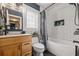 Modern bathroom with subway tile, a soaking tub, and updated vanity at 1217 E Flora St, Tampa, FL 33604