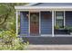 Inviting front porch with a wreath and stylish decor at 1217 E Flora St, Tampa, FL 33604