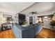 Living room with hardwood floors, sectional sofa, and fireplace at 1217 E Flora St, Tampa, FL 33604