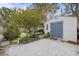 Detached storage shed with double doors and concrete slab at 1217 E Flora St, Tampa, FL 33604