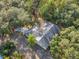 Aerial view of the house nestled amongst lush greenery at 12240 Eakin St, Weeki Wachee, FL 34614