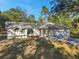 Single-story house with a large yard and driveway at 12240 Eakin St, Weeki Wachee, FL 34614