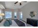 Spacious bedroom with a dresser and large windows at 12240 Eakin St, Weeki Wachee, FL 34614