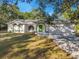 Front view of a single story house with green accents at 12240 Eakin St, Weeki Wachee, FL 34614