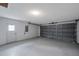 Garage interior with an overhead door and extra storage space at 12240 Eakin St, Weeki Wachee, FL 34614