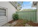 Small, fenced patio area with gravel and plants at 13000 Club Dr, Hudson, FL 34667