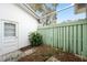 Small, fenced patio area with gravel and plants at 13000 Club Dr, Hudson, FL 34667