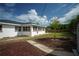 Fenced backyard with a grassy area and shed at 1338 Whitacre Dr, Clearwater, FL 33764