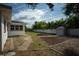 Landscaped backyard with shed and patio at 1338 Whitacre Dr, Clearwater, FL 33764