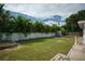 Large backyard with grassy lawn and storage shed at 1338 Whitacre Dr, Clearwater, FL 33764