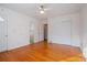 Well-lit bedroom with hardwood floors and double doors at 1338 Whitacre Dr, Clearwater, FL 33764