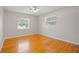 Hardwood floors and large windows in this bright bedroom at 1338 Whitacre Dr, Clearwater, FL 33764