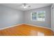 Spacious bedroom featuring hardwood floors and a large window at 1338 Whitacre Dr, Clearwater, FL 33764