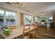 Light-filled dining area with wood floors and large windows at 1338 Whitacre Dr, Clearwater, FL 33764