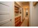 Hallway with built-in shelves and hardwood floors at 1338 Whitacre Dr, Clearwater, FL 33764