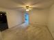 Bedroom with patio access and a ceiling fan at 13986 Bonnie Brae Dr, Largo, FL 33774