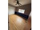 Bright bedroom featuring light wood floors and a ceiling fan at 13986 Bonnie Brae Dr, Largo, FL 33774