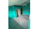 Teal walls and carpeted bedroom with a closet and ceiling fan at 13986 Bonnie Brae Dr, Largo, FL 33774