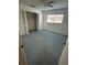 Bright bedroom with carpet and spacious closet at 13986 Bonnie Brae Dr, Largo, FL 33774