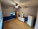 Bedroom with hardwood floors and dresser at 13986 Bonnie Brae Dr, Largo, FL 33774