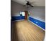 Spacious bedroom with wood floors and a ceiling fan at 13986 Bonnie Brae Dr, Largo, FL 33774