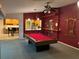 Game room with pool table and kitchen view at 13986 Bonnie Brae Dr, Largo, FL 33774