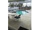 Relaxing pool and spa with patio furniture under a screened enclosure at 13986 Bonnie Brae Dr, Largo, FL 33774