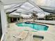 Relaxing pool and patio area, perfect for entertaining at 13986 Bonnie Brae Dr, Largo, FL 33774