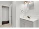 Grey vanity with white subway tile and bronze fixtures at 1437 Park St, Clearwater, FL 33755