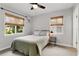 Bright bedroom with a comfortable bed and two windows at 1437 Park St, Clearwater, FL 33755