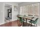 Small dining area with a wooden table and green chairs at 1437 Park St, Clearwater, FL 33755