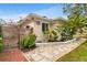 Tan house exterior with wood fence and walkway at 1437 Park St, Clearwater, FL 33755