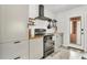 Modern kitchen with grey cabinets and wood countertops at 1437 Park St, Clearwater, FL 33755