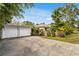 Home exterior featuring a two-car garage and driveway at 1437 Park St, Clearwater, FL 33755