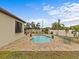 Pool area with patio and landscaping at 1575 N River Cir, Tarpon Springs, FL 34689