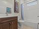 Bathroom with tub, shower, and colorful accents at 1575 N River Cir, Tarpon Springs, FL 34689