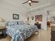 Bright bedroom with a king-size bed and ensuite bathroom at 1575 N River Cir, Tarpon Springs, FL 34689