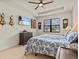 Bright bedroom with a comfortable bed and large window at 1575 N River Cir, Tarpon Springs, FL 34689