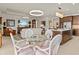 Bright dining area with glass-top table and wicker chairs at 1575 N River Cir, Tarpon Springs, FL 34689