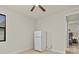 Guest bedroom with refrigerator and access to other rooms at 1575 N River Cir, Tarpon Springs, FL 34689